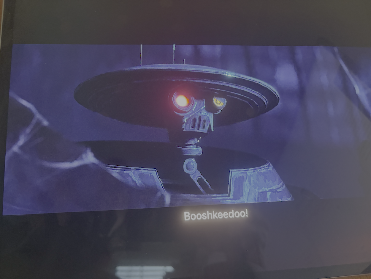 Spybot in a blue cave, glowing eye